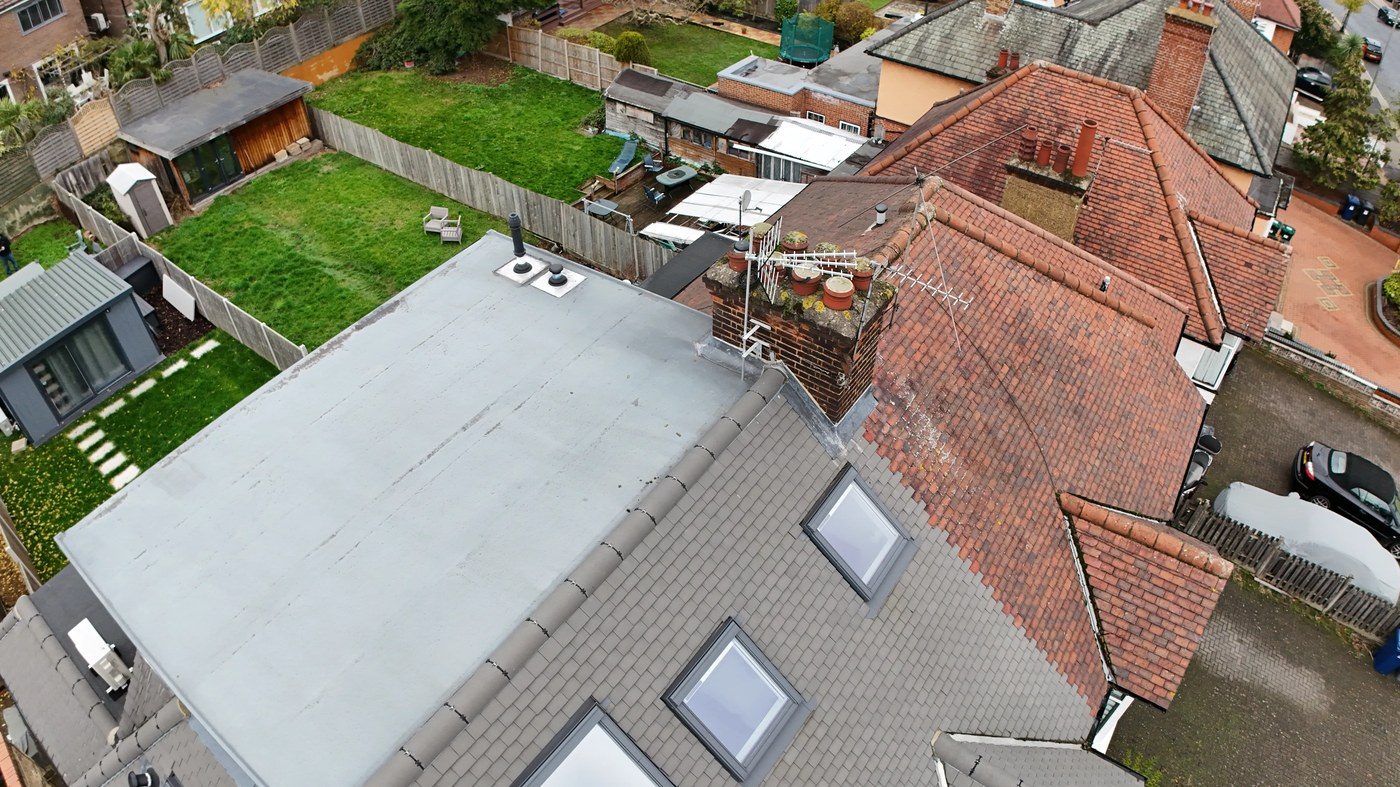 Overhead drone view of chimney stack showing significant vegetation growth at pot and flaunching