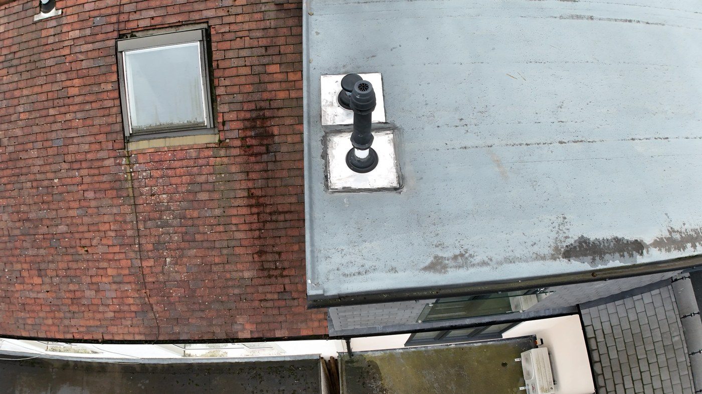Water staining on flat roof section — evidence of water ingress
