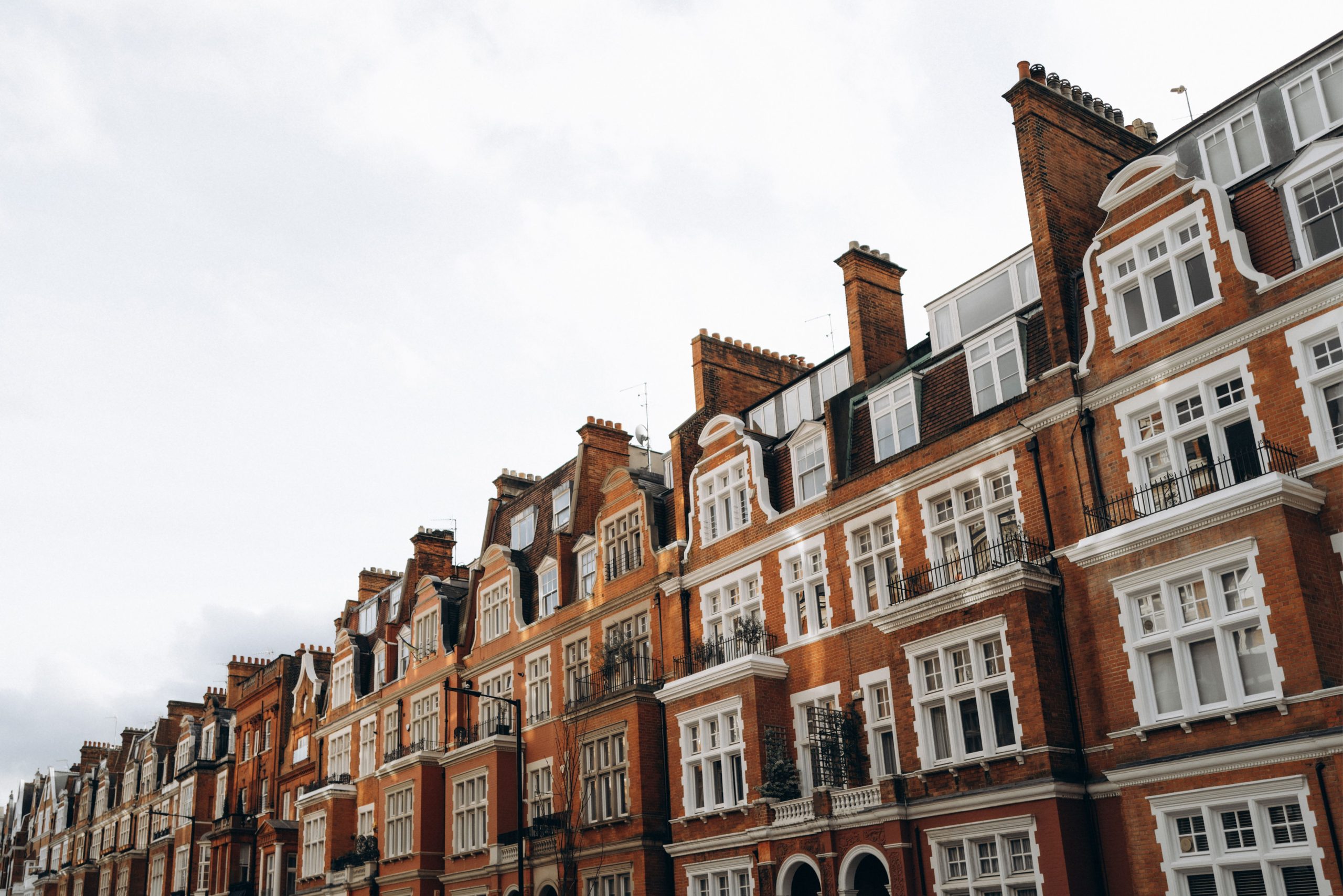Classic red brick terraced houses in a residential district of London