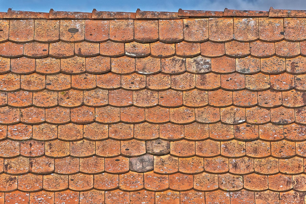 Weathered pitched roof tiles